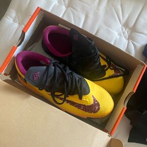 Yellow purple and black Nike kd’s
